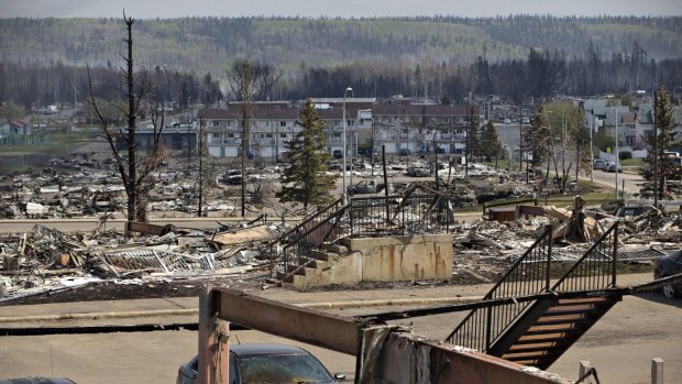 The charred remains of various structures in the suburb of Abasand in Fort McMurray, Alberta.