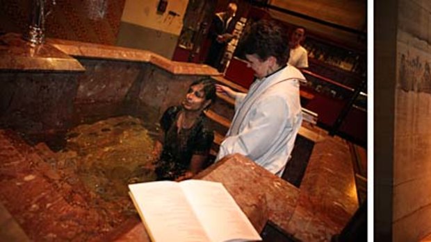 Left: full-body baptisms at the dawn service at St Paul's Cathedral as, right, the "new fire" burnt at the entrance.