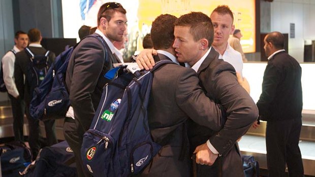 Brothers in arms ... Todd Carney gives Robbie Farah a hug.