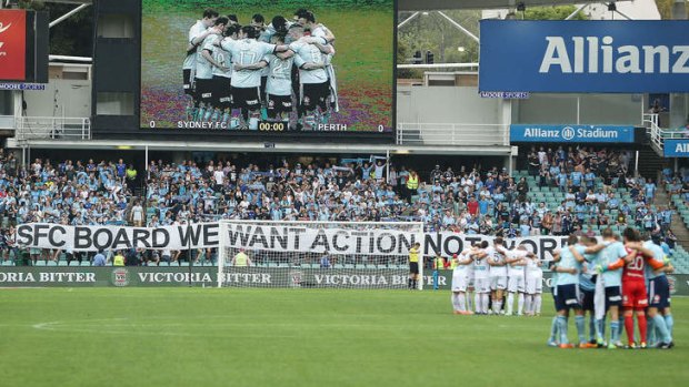 No ambiguity: Sydney FC fans hold up banners during the round-19 match against Perth Glory at Allianz Stadium.