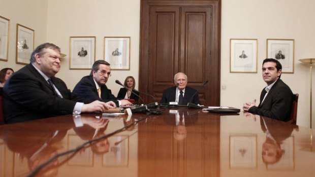 Greek President, Karolos Papoulias (centre) meets (from left to right) PASOK leader Evangelos Venizelos, New Democracy leader Antonis Samaras and Syriza leader Alexis Tsipras at the presidential palace on Sunday.