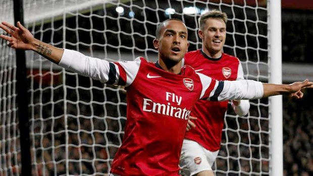 Theo Walcott celebrates after equalising for Arsenal against Liverpool.