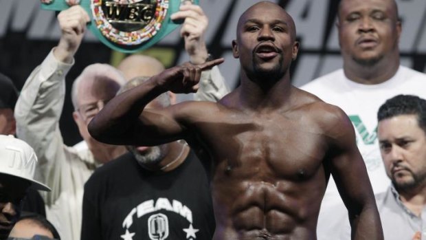 Floyd Mayweather makes a point at the weigh in.