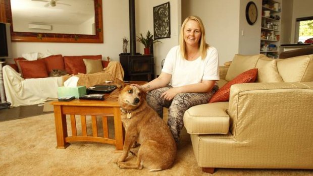 Mobility: House-sitter Nicole Sundin, with a client's dog, moves between homes to save money.