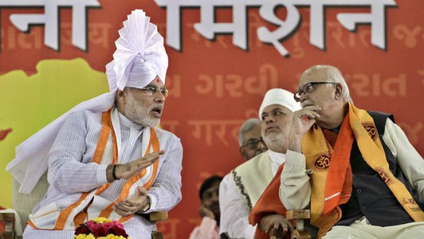 Uneasy allies: Gujarat state Chief Minister Narendra Modi, left, speaks with his party's senior leader, Lal Krishna Advani.