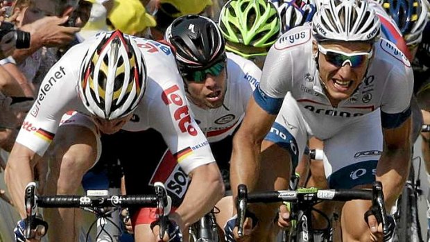 Controversy: Mark Cavendish (centre) is squeezed out in a bunch sprint finish to stage 10 of the Tour de France after colliding with Dutch rider Tom Veelers, who crashed.