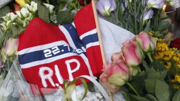 Mourning: Flowers and a flag for the victims of the shooting spree and bomb attack in 2011.