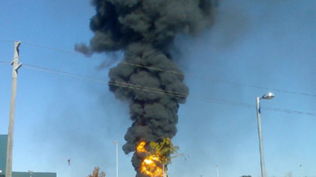 A massive blaze and column of smoke shoots into the sky as the petrol tanker explodes.