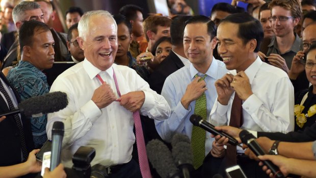 Relaxed: Prime Minister Malcolm Turnbull and Indonesian President Joko Widodo take off their ties during a visit to Tanah Abang Market in Jakarta in November 2015. 