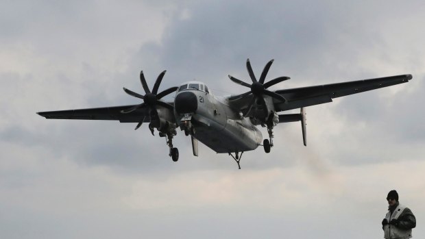 A file photo of a US Navy C-2 Greyhound aircraft. Japan's defense minister indicated that the plane might have had engine trouble.