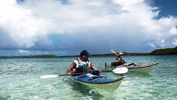 Sea urchins ... Epeli instructs a kayaker.