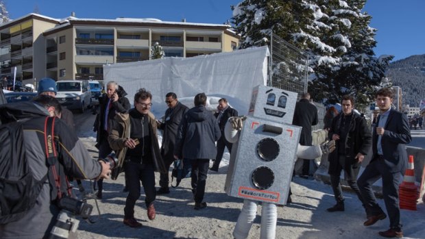 A person in a robot costume at the World Economic Forum in Davos in January promoted this weekend's basic income referendum in Switzerland