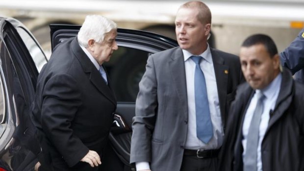 The regime: Syrian Foreign Minister Walid al Moallem arrives at peace talks in Geneva.