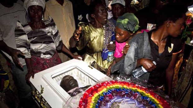 Righteous anger ... mourners grieve over David Kato's coffin near Namataba.
