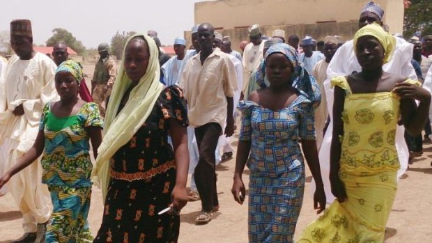 Lucky escape ... Four female students of Chibok Government Girls Secondary School, who were abducted by gunmen and reunited with their families, walk in Chibok, Nigeria.