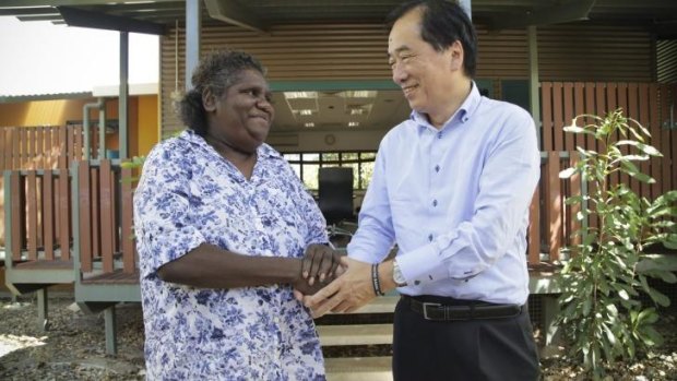 Annie Ngalmirama greets former Japanese Prime Minister Naoto Kan in Jabiru, Kakadu National Park.