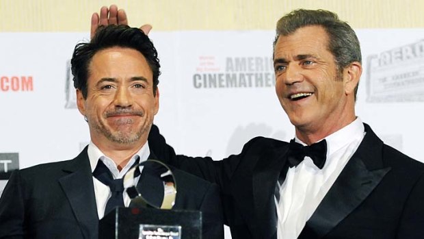 Friendly face: Mel Gibson has received support from Robert Downey jnr.
