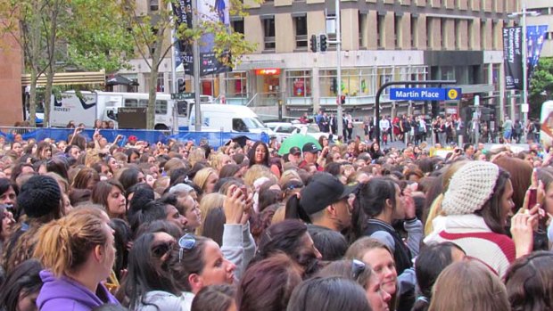 Mayhem ... fans flock to see One Direction in Sydney today.