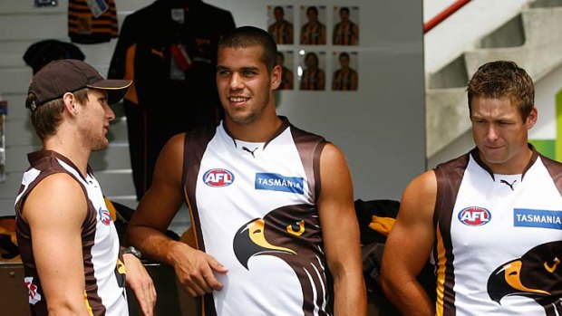 Hawthorn players (L-R) Stephen Gilham, Lance Franklin and Stuart Dew model the late noughties Hawk model.