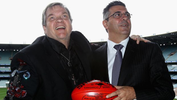 Rock on ... AFL boss Andrew Demetriou with Meat Loaf before the grand final.