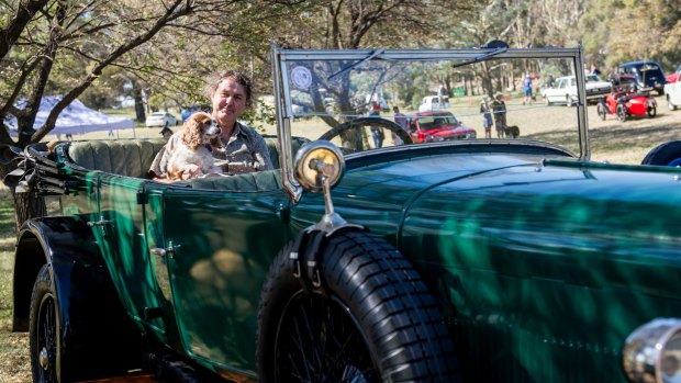 Ross Merdal with his dog in a 1924 Sunbeam at the ACT Council of Motor Clubs Wheels event in Kings park.
