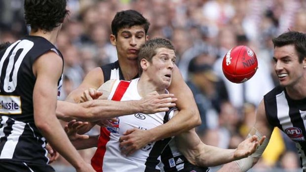 St Kilda's Nick Dal Santo amid a host of Magpies last weekend. Will Collingwood's manic tackling and defensive pressure go the distance?