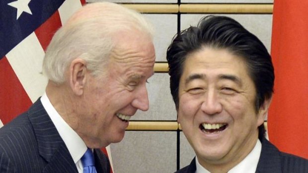 US Vice President Joe Biden exchange smiles with Japanese Prime Minister Shinzo Abe at the start of their meeting at Abe's official residence in Tokyo.