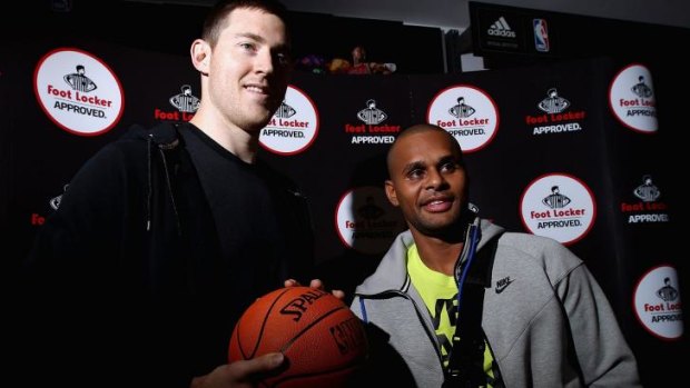 Back home: Patty Mills (right) and Aron Baynes  on Tuesday.