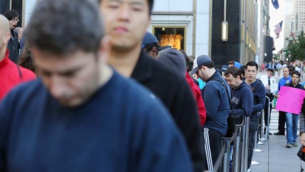 Customers queue for the iPhone 5 in New York at the weekend.