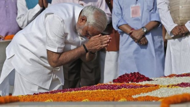 Narendra Modi pays his respects at the Mahatma Gandhi memorial before being sworn in.