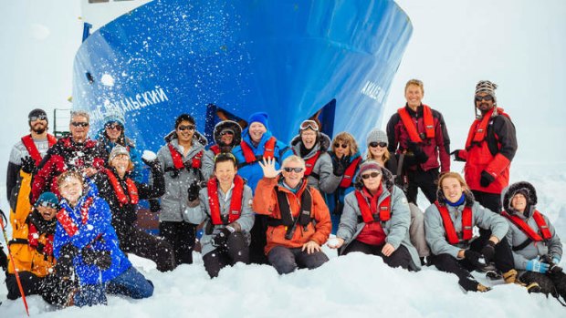 A longer trip than they thought: Passengers on the Akademik Shokalskiy gather on the ice.