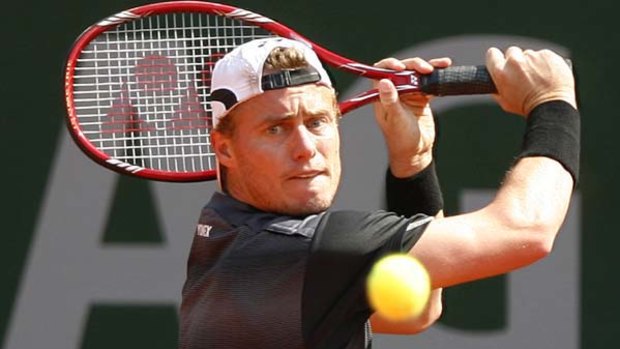 Australia's Lleyton Hewitt is through to the second round of the Gerry Weber Open in Germany.