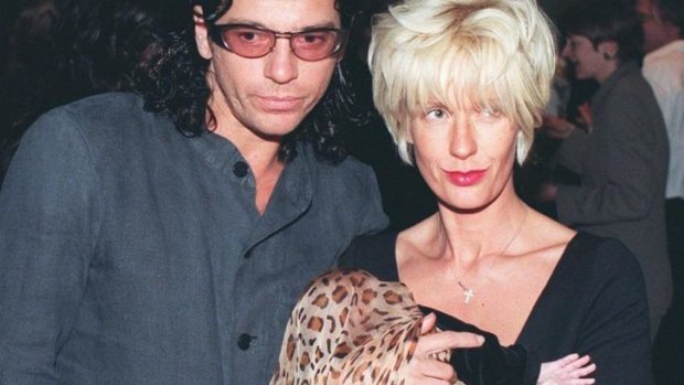 Death investigated: INXS singer Michael Hutchence with partner Paul Yates and daughter Heavenly Hiraani Tiger Lily.