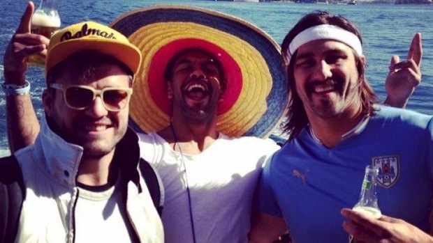 Adam Ashley-Cooper, Kurtley Beale and Jacques Potgieter whoop it up on the harbour on Monday.