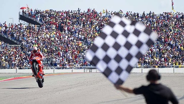 Two-time world champion ... Casey Stoner celebrates victory in Spain in September 19, 2010.