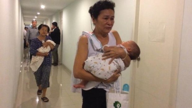 Offspring: Two of the babies found with surrogate mothers in a Bangkok condominium.