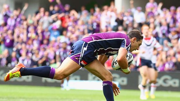 Stooping to conquer... Billy Slater scores again.