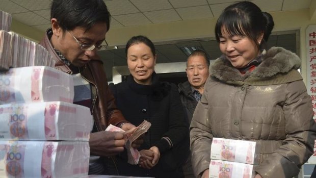 Pay day: A member of the Jianshe rural co-operative collects her bonus.