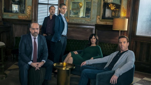 Paul Giamatti as Chuck Rhoades, David Costabile as Mike "Wags" Wagner, Asia Kate Dillon as Taylor, Maggie Siff as Wendy Rhoades and Damian Lewis as Bobby "Axe" Axelrod.