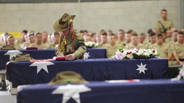 The bodies of three Australian soldiers killed in Afghanistan are returned to Amberley Air Base last year.