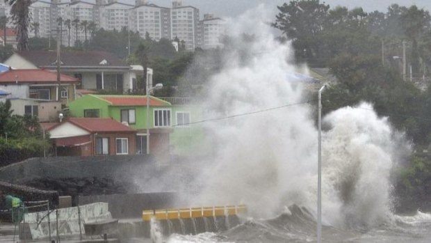 Waves crash as Typhoon Neoguri approaches the village in Seogwipo on Jeju Island, South Korea.