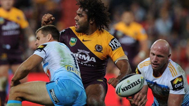 Hair-raising: Big Sam Thaiday celebrates another try for the Broncos.