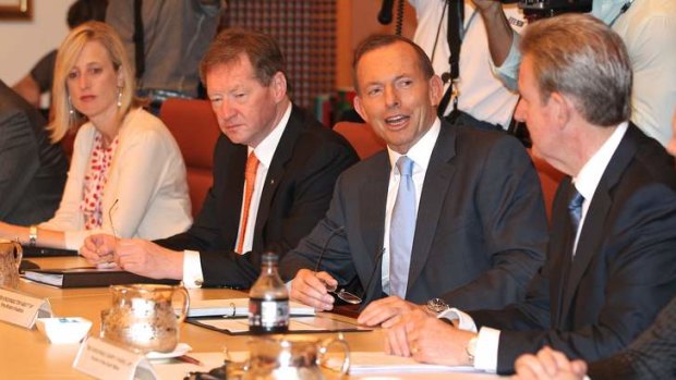 ACT Chief Minister Katy Gallagher, Dr Ian Watt, Secretary of Prime Minister and Cabinet, Prime Minister Tony Abbott and NSW Premier Barry O'Farrell, during the COAG meeting.