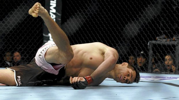 Rich "Ace" Franklin falls after being knocked out by Cung Le in their UFC middleweight bout in Macua.
