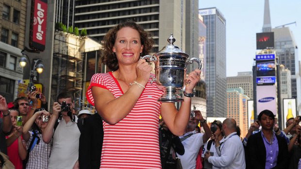 Champion ... Samantha Stosur keeps a firm grip on the US Open winner's trophy in Times Square.