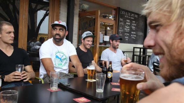 A week early: Instead of preparing for a grand final, Sydney Swans retirees Jude Bolton and Martin Mattner (right) drowned their sorrows with Ted Richards, Adam Goodes and company at Marrickville's Victoria on the Park Hotel on Tuesday.