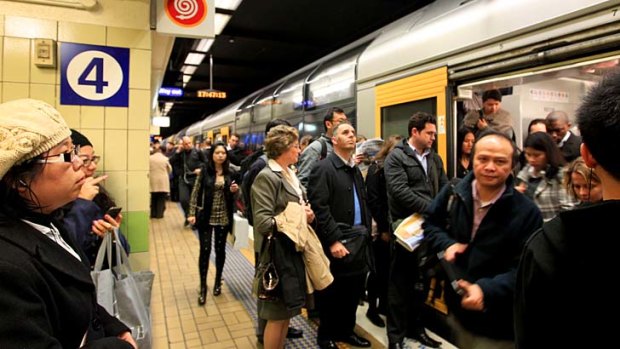 "Intolerable" ... passengers squeeze onto a train during peak hour.