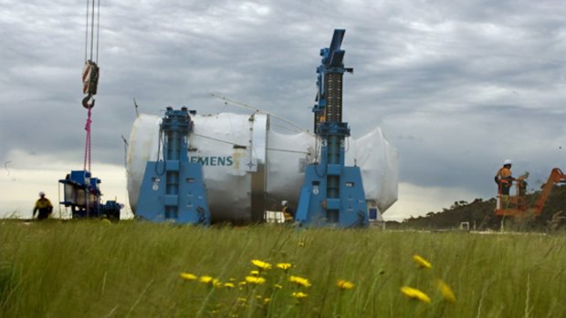 A new gas-fired turbine makes its slow way to Mortlake power station.