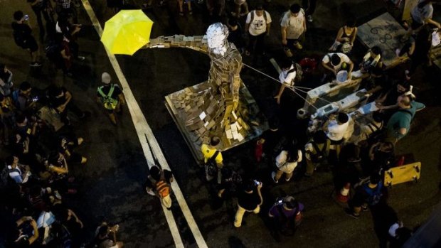 'Umbrella Man' by the artist known as Milk stands at a pro-democracy protest site next to the central government offices in Hong Kong.