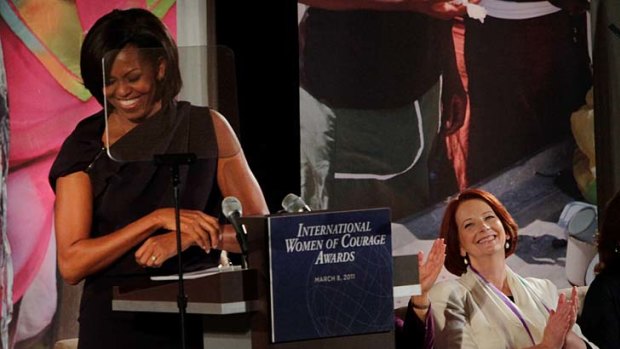 Michelle Obama, left, pictured with Australia Prime Minister Julia Gillard.